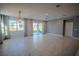 Bright living room featuring tile floors, recessed lighting, large windows, and sliding glass doors to the lanai at 1114 Turquoise Waves Cv, Kissimmee, FL 34747
