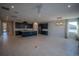 Open concept living area featuring tile flooring, recessed lighting, and a gourmet kitchen with stainless steel appliances at 1114 Turquoise Waves Cv, Kissimmee, FL 34747