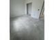 Unfinished bedroom featuring light walls, concrete flooring, and an open doorway at 13441 Sw 60Th Avenue Rd, Ocala, FL 34473