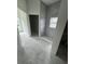 Under-construction bathroom featuring a tiled walk-in shower and view from the window at 13449 Sw 60Th Avenue Rd, Ocala, FL 34473