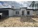 Modern single-story home with a two-car garage, minimal landscaping, and a contemporary front entrance at 13449 Sw 60Th Avenue Rd, Ocala, FL 34473