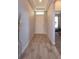 Inviting entryway featuring wood-look tile flooring, natural light, and a view into an adjacent room at 13531 Lake Yale View Loop, Grand Island, FL 32735