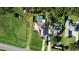 Aerial view of a beautiful home with in-ground pool, next to a road at 1384 E Lake Shore Blvd, Kissimmee, FL 34744