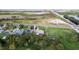 Aerial shot of the home, a pond, and the surrounding landscape and greenery at 1384 E Lake Shore Blvd, Kissimmee, FL 34744