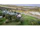 Aerial view of the neighborhood, the backyard, and the surrounding landscape at 1384 E Lake Shore Blvd, Kissimmee, FL 34744