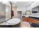 Luxurious bathroom with a soaking tub, walk-in shower, sleek cabinets, and modern fixtures at 1384 E Lake Shore Blvd, Kissimmee, FL 34744
