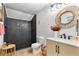 Modern bathroom featuring a walk-in shower, stylish vanity, a toilet and decorative accessories at 1384 E Lake Shore Blvd, Kissimmee, FL 34744
