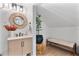 Stylish bathroom features a modern vanity, decorative mirror, and a plant on a wicker stand at 1384 E Lake Shore Blvd, Kissimmee, FL 34744