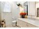 Bathroom with white cabinets, marble countertop, and decor at 1384 E Lake Shore Blvd, Kissimmee, FL 34744