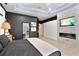 Bedroom featuring stone accent wall with fireplace and access to the bathroom at 1384 E Lake Shore Blvd, Kissimmee, FL 34744
