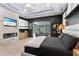 Modern bedroom features stone accent wall with fireplace and view of outdoor pool area at 1384 E Lake Shore Blvd, Kissimmee, FL 34744