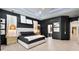 Sleek bedroom features a tray ceiling, recessed lighting, and modern pendant lights at 1384 E Lake Shore Blvd, Kissimmee, FL 34744