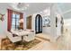 Inviting dining room featuring a pendant chandelier, with large windows at 1384 E Lake Shore Blvd, Kissimmee, FL 34744