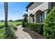 Attractive home featuring a paver walkway, manicured landscaping, and vibrant green plants at 1384 E Lake Shore Blvd, Kissimmee, FL 34744