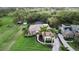 Stunning home with a tile roof, a paved driveway, and lush tropical landscaping at 1384 E Lake Shore Blvd, Kissimmee, FL 34744