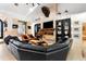 Cozy living room featuring a modern fireplace, comfortable seating, and contemporary decor at 1384 E Lake Shore Blvd, Kissimmee, FL 34744