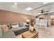 Comfortable living area with a kitchenette features a large sectional couch and wicker coffee table at 1384 E Lake Shore Blvd, Kissimmee, FL 34744