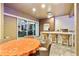 A complete outdoor kitchen and dining area featuring a grill, counter seating, and a table at 1384 E Lake Shore Blvd, Kissimmee, FL 34744