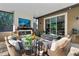 A comfortable outdoor living space features a fireplace, a TV, and an inviting seating area at 1384 E Lake Shore Blvd, Kissimmee, FL 34744