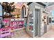 A glimpse of a playroom with toys and a pass-through play area, showcasing a whimsical design at 1384 E Lake Shore Blvd, Kissimmee, FL 34744