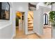 Intriguing hidden staircase behind a bookshelf, adding a unique and playful element to the home's design at 1384 E Lake Shore Blvd, Kissimmee, FL 34744