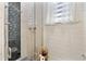 Bathroom shower featuring mosaic tile and glass enclosure at 1384 E Lake Shore Blvd, Kissimmee, FL 34744