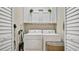 Laundry room with updated machines and storage at 14072 Wild Majestic St, Orlando, FL 32828