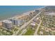 Scenic aerial view of a coastal community, featuring condominiums and beach access at 1415 Ocean Shore Blvd # 704, Ormond Beach, FL 32176