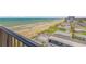 Balcony view overlooking a scenic beach and coastal neighborhood at 1415 Ocean Shore Blvd # 704, Ormond Beach, FL 32176