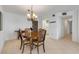 Dining room features a chandelier and table, perfect for entertaining guests at 1415 Ocean Shore Blvd # 704, Ormond Beach, FL 32176