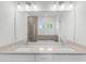 Bathroom featuring double sink vanity, soaking tub, and walk-in shower at 15491 Lebeau Loop, Winter Garden, FL 34787