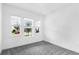 Bedroom boasting natural light from three windows and neutral carpet at 15491 Lebeau Loop, Winter Garden, FL 34787
