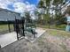 Community dog park with gated entry, seating, and waste station at 15491 Lebeau Loop, Winter Garden, FL 34787