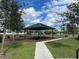 Community pavilion with picnic tables, benches, and playground access at 15491 Lebeau Loop, Winter Garden, FL 34787