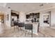 Modern kitchen with granite countertops, stainless steel appliances, and a breakfast bar with seating at 1700 Three Bars Rd, Kissimmee, FL 34744