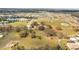 Expansive aerial view of property, showcasing acreage, house, and nearby community at 1775 Druliner Rd, St Cloud, FL 34771