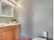 Simple powder room with neutral paint, pedestal sink, updated faucet and lighting at 1775 Druliner Rd, St Cloud, FL 34771