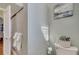 Bathroom with decorative wall art, toilet, and a glass shower at 1775 Druliner Rd, St Cloud, FL 34771