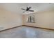Spacious bedroom featuring neutral walls, tile floors, and a window with natural light at 1775 Druliner Rd, St Cloud, FL 34771