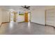 Large bedroom with ceiling fan, tile flooring, and closet; view of ensuite bathroom at 1775 Druliner Rd, St Cloud, FL 34771