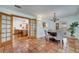 Open dining area with tile flooring, a chandelier, and glass door that opens to a patio at 1775 Druliner Rd, St Cloud, FL 34771