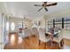 Open-concept dining area with hardwood floors connecting to the living room, great for entertaining at 1775 Druliner Rd, St Cloud, FL 34771