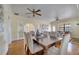 Elegant dining area featuring hardwood floors and seamless flow into the living room at 1775 Druliner Rd, St Cloud, FL 34771