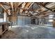 Spacious, unfinished garage space with exposed beams and concrete floor for versatile use at 1775 Druliner Rd, St Cloud, FL 34771