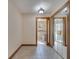 Hallway with a glimpse into a modern ensuite bathroom featuring a tiled shower at 1775 Druliner Rd, St Cloud, FL 34771