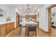 Spacious kitchen with wooden cabinets, white countertops, a large island with seating and stainless steel appliances at 1775 Druliner Rd, St Cloud, FL 34771