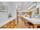 Bright kitchen with wooden cabinets and floors, white countertops, a large island and stainless steel appliances at 1775 Druliner Rd, St Cloud, FL 34771