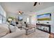 Cozy living room with plush carpet, neutral furniture, and bright natural light, perfect for relaxing at 1775 Druliner Rd, St Cloud, FL 34771