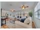 Spacious living room features neutral walls, tile floor, and ceiling fan at 1775 Druliner Rd, St Cloud, FL 34771
