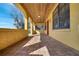 Covered patio with tiled floor, arched openings, and serene view at 1775 Druliner Rd, St Cloud, FL 34771